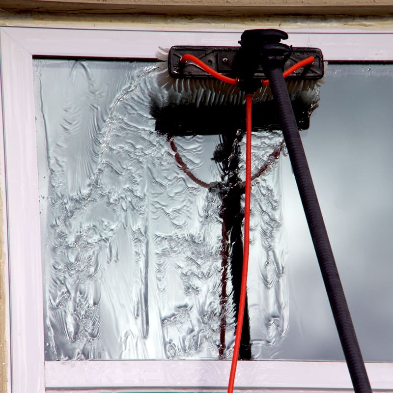 ww.1T4A8979 Famously Clean on Robinson Street in Orlando cleaning windows at a business